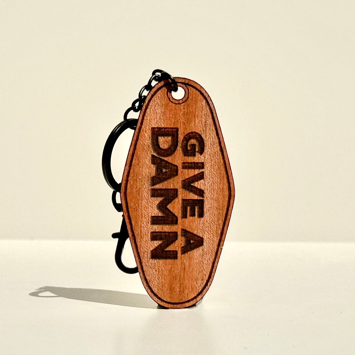 Give A Damn Hotel Keychain