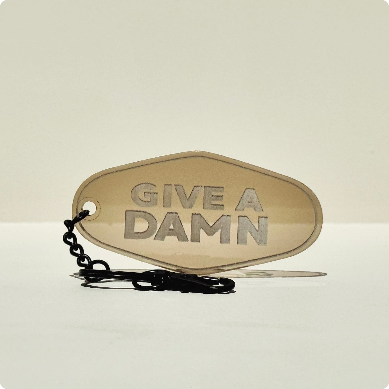 Give A Damn Hotel Keychain