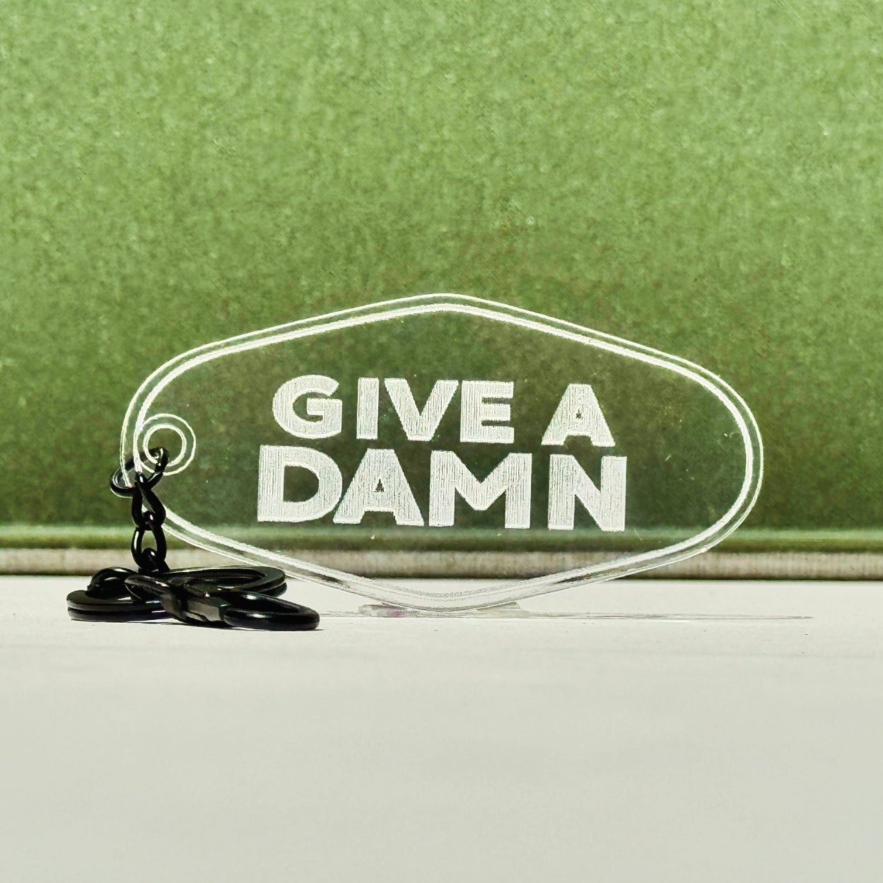 Give A Damn Hotel Keychain